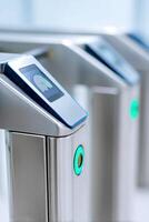 Modern biometric turnstile system for secure access control in public spaces, featuring fingerprint recognition technology and user-friendly interface, security concept photo