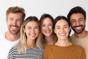 Group of diverse young adults smiling joyfully together in bright studio setting showcasing friendship and connection among individuals with warm expressions and positive energy photo