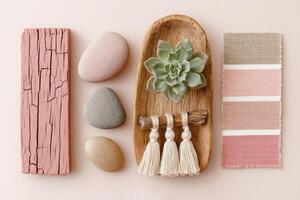 Natural decor arrangement featuring smooth stones, a succulent plant in a wooden bowl, and a textured fabric, creating a calming and aesthetic home environment with earthy tones photo