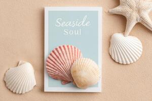 Colorful seashells arranged around a card with the text Seaside Soul on a sandy background, creating a tranquil coastal atmosphere for summer-themed designs photo