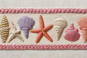 Colorful embroidered seashells and starfish arranged in a decorative pattern on a textured fabric background, showcasing intricate craftsmanship and marine-inspired design elements photo