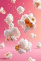 Floating popcorn kernels in mid-air against a vibrant pink background, showcasing their fluffy texture and playful movement, creating a fun and dynamic food scene photo
