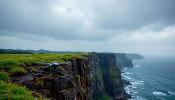 Drone on Clifftop Overlooking Dramatic Coastal Landscape A breathtaking view from a high coastal cliff photo
