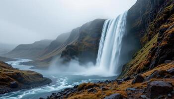 Majestic Waterfall cascading down rocky cliffs into a serene river valley A breathtaking natural landscape scene photo