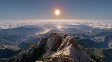 Majestic Mountain Peak Sunrise Over a Sea of Clouds Breathtaking Panoramic View photo