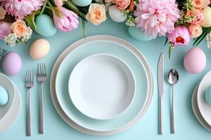 Festive easter table setting decorated with colorful eggs and spring flowers photo