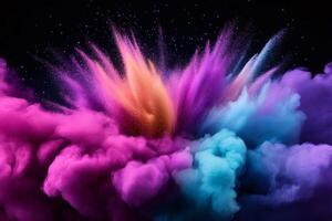 Colorful powder exploding on black background creating a vibrant cloud photo