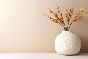Modern vase with dried flowers creating cozy autumn atmosphere on shelf photo