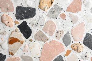 Terrazzo flooring showing colorful stone fragments embedded in concrete photo