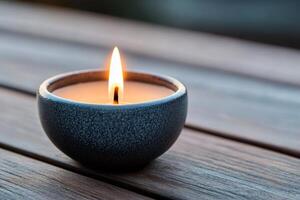 Burning scented candle creating relaxing atmosphere on wooden table photo