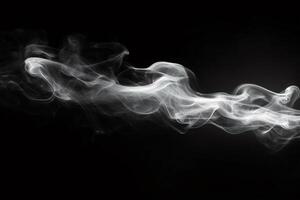 White smoke flowing on dark background creating abstract shapes photo