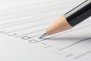 Person checking boxes on checklist with pencil, completing tasks efficiently photo