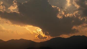 Sunset over mountains with clouds video