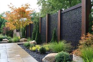 Modern garden design featuring a decorative metal and wood privacy screen photo