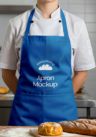 A baker wearing a blue apron with Bakery Mockup Apron Mockup printed on it stands in a bakery with freshly baked bread psd