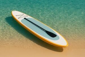 Bright paddleboard with black paddle floats at the edge of turquoise sea and sandy beach. A serene tropical image perfect for vacation themes, water sports, and summer lifestyle visuals photo