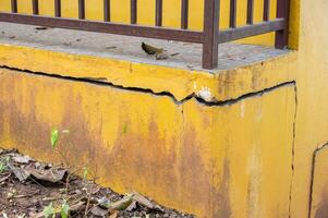 House having damaged from an earthquake. An earthquake is a shaking of the ground caused by movement of the Earth's crust. photo