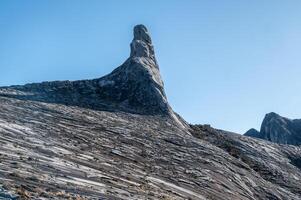 Granite plateau on Mt.Kinabalu with an iconic Donkey's Ear Peak. photo