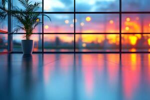 Serene Sunset Reflections in Modern Glass Interior with Potted Plant photo