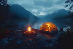Tranquil Mountain Camping by a Lake at Dusk with Glowing Tent and Campfire photo