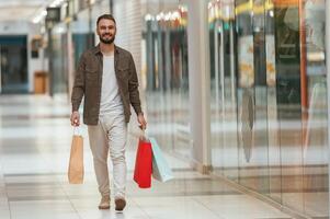 Man is shopping in the supermarket photo