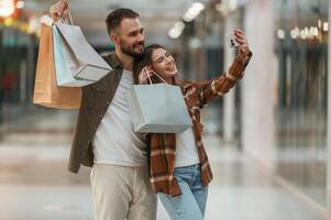 Making, selfie. Young couple are in supermarket together photo