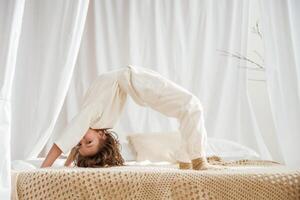Playing on the bed. Cute little, girl ,is at home. photo