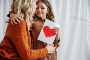 Conception of mother's, day ,celebration. Parent with daughter at home photo