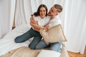 Embracing each other. Young ,couple ,are ,together at home photo