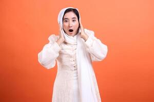 Unexpected revelation, woman with a hijab expressing profound su photo