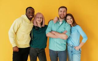 Front view... Group ,of, friends are in the studio against background photo
