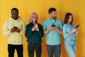 Group of, friends are in the studio against background photo