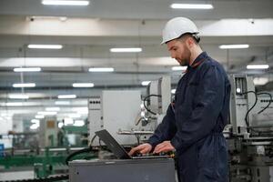 Busy, employee. Factory ,,worker is indoors with hard hat photo