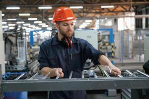 Industrial, line, working. Factory worker ,,is indoors with hard hat photo