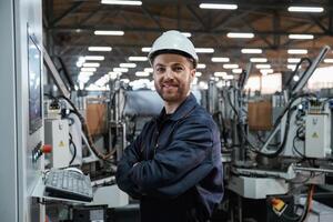 Using, equipment, operator. Factory, worker is indoors with hard hat photo
