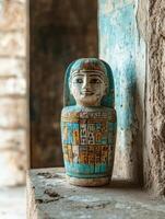 Ancient Egyptian canopic jar with hieroglyphs. photo