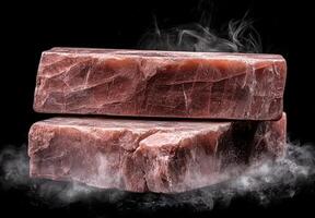 Two blocks of pink salt with steam photo
