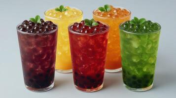 A collection of five colorful bubble tea drinks with tapioca pearls. photo