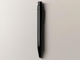 Elegant black pen resting on a neutral surface photo