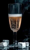 Elegant champagne flute with bubbles and dry ice effect photo