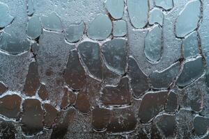 Frozen water droplets create an abstract, textured pattern photo