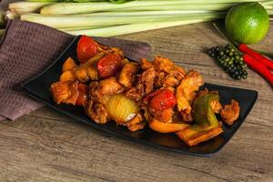 A plate of food with vegetables and chicken on it photo