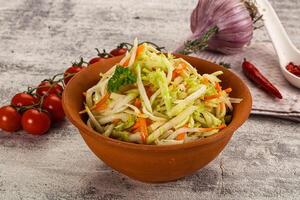 A bowl of salad with tomatoes and onions photo