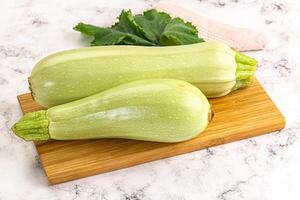 Two squash on a cutting board photo