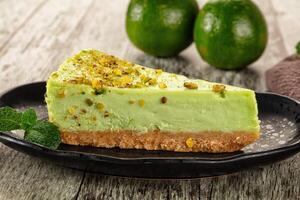 Green pistachio cheesecake served mint photo