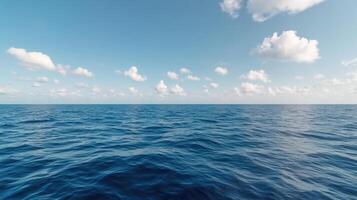 Calm ocean waves reflect serene sky with fluffy clouds, creating tranquil atmosphere photo