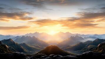 Majestic mountains bathed in golden sunlight at dawn, creating serene landscape photo
