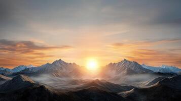 The sun rising over the mountains in a beautiful sunset photo