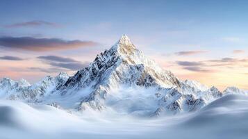A mountain range covered in snow at sunset photo