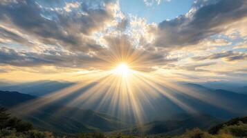 Sunbeams shining through clouds over mountains photo